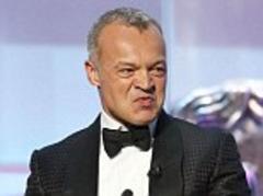 tv baftas 2013: host graham norton makes controversial jokes about jimmy savile and rolf harris